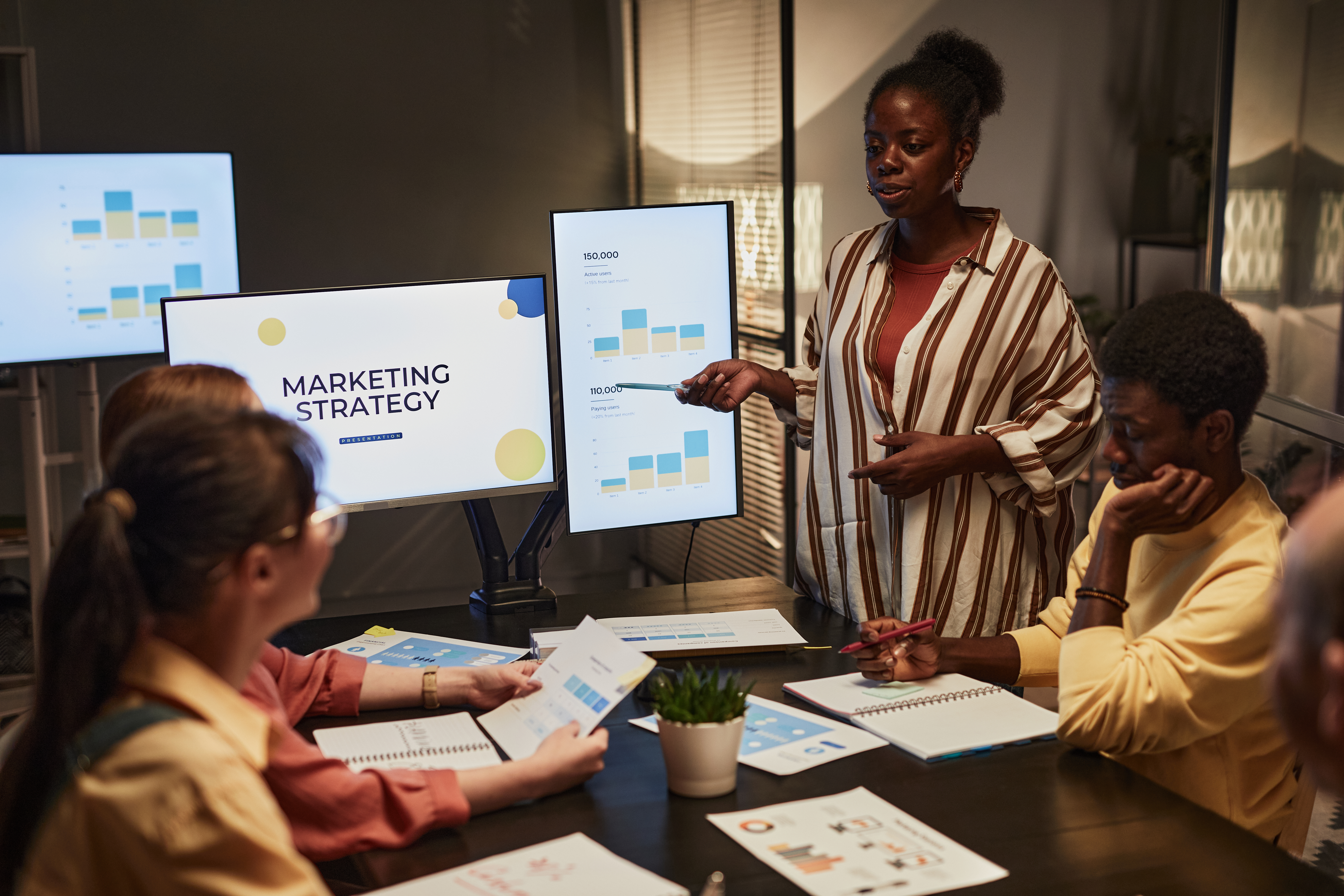 black-woman-presenting-plan-at-meeting-2025-03-05-23-10-33-utc